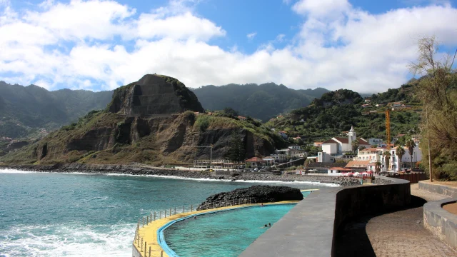 Infinity pool filled with seawater overlooking the Atlantic Ocean in Porto da Cruz, Madeira.