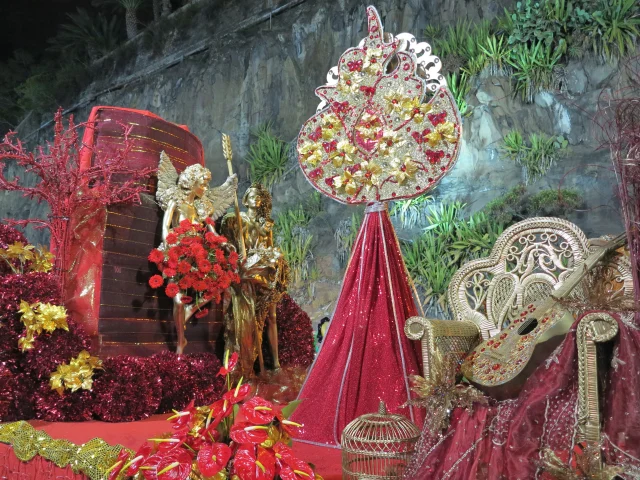 Carnival performer wearing an elaborate floral costume during the Madeira Carnival Parade